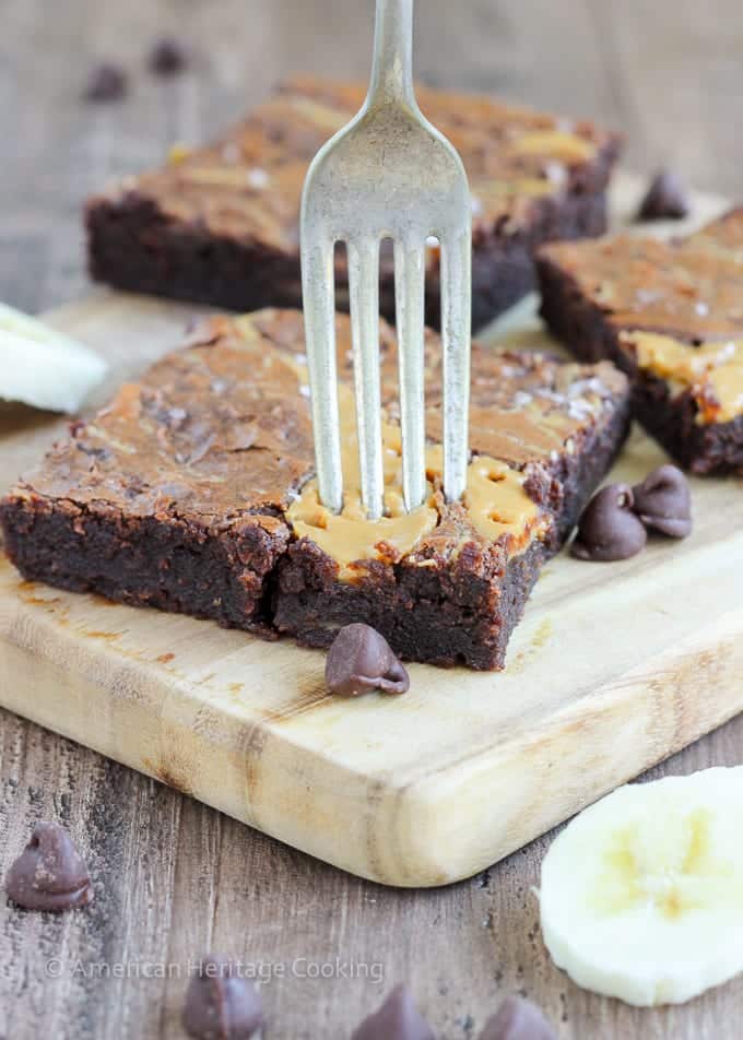 These Triple Chocolate Peanut Butter Banana Brownies are rich and chewy! The perfect combination of flavors! Plus a new way to use up those over-ripe bananas on your counter!  