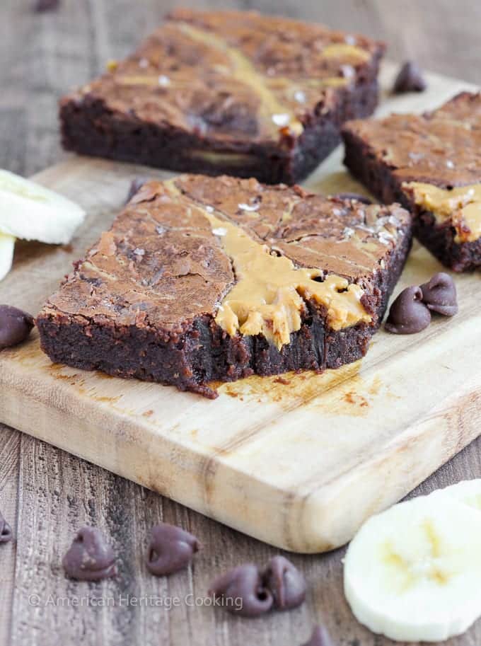 These Triple Chocolate Peanut Butter Banana Brownies are rich and chewy! The perfect combination of flavors! Plus a new way to use up those over-ripe bananas on your counter!  