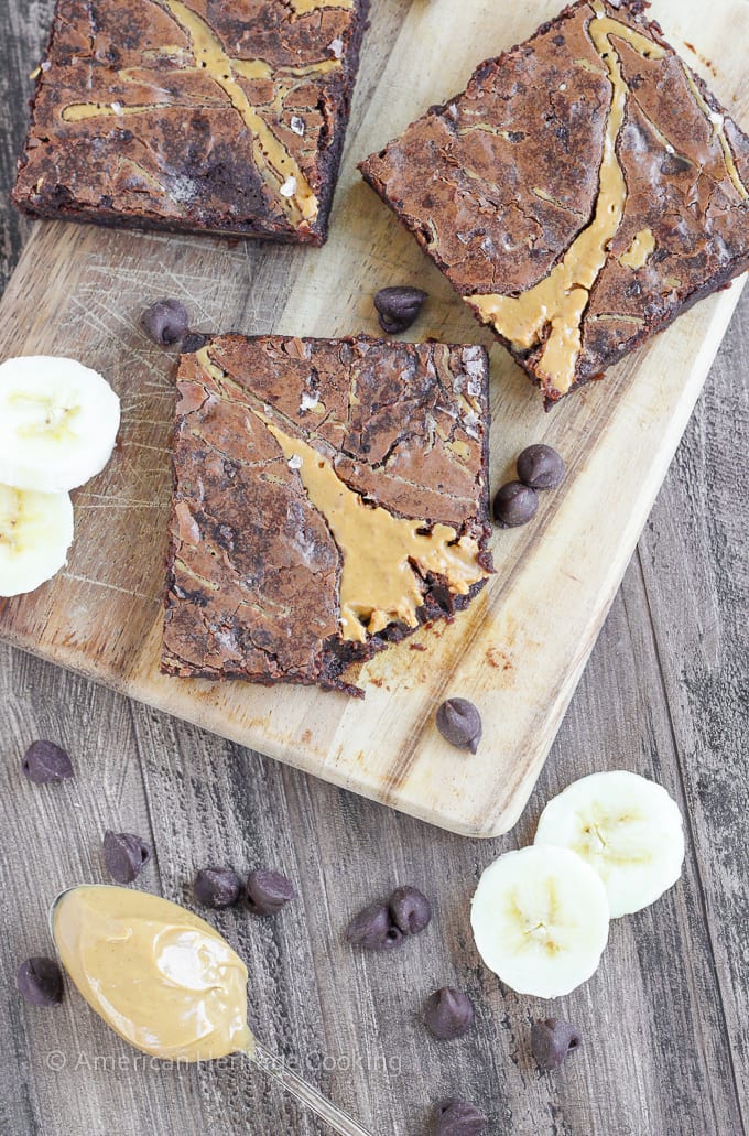 These Triple Chocolate Peanut Butter Banana Brownies are rich and chewy! The perfect combination of flavors! Plus a new way to use up those over-ripe bananas on your counter!  