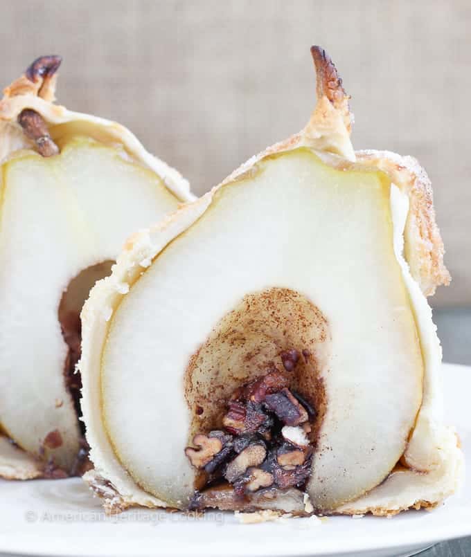 These Brown Sugar Pecan Stuffed Pears are d’Anjou pears stuffed with a simple mixture of brown sugar, cinnamon, cardamom and toasted pecans are wrapped in a flakey pastry, sprinkled with more sugar and topped with a warm butterscotch sauce. 