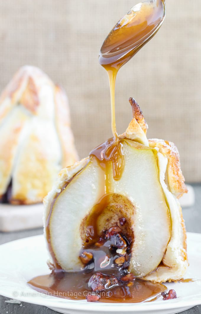 These Brown Sugar Pecan Stuffed Pears are d’Anjou pears stuffed with a simple mixture of brown sugar, cinnamon, cardamom and toasted pecans are wrapped in a flakey pastry, sprinkled with more sugar and topped with a warm butterscotch sauce. 
