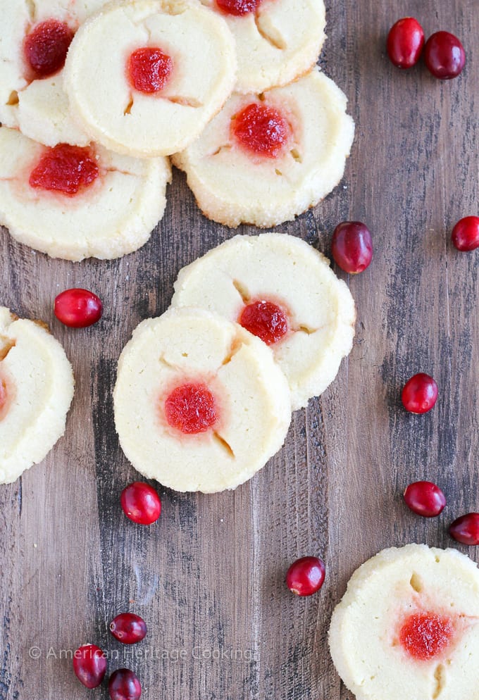 These Cranberry Thumbprint Cookies are a buttery shortbread cookie dough filled with a Moscato cranberry jam and baked to soft, tender perfection. 