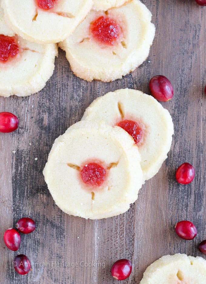 These Cranberry Thumbprint Cookies are a buttery shortbread cookie dough filled with a Moscato cranberry jam and baked to soft, tender perfection. 