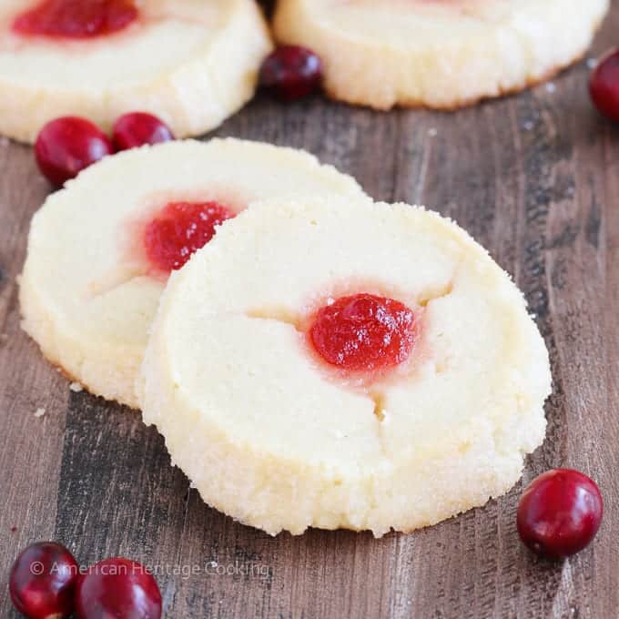These Cranberry Thumbprint Cookies are a buttery shortbread cookie dough filled with a Moscato cranberry jam and baked to soft, tender perfection.