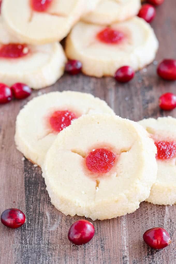 These Cranberry Thumbprint Cookies are a buttery shortbread cookie dough filled with a Moscato cranberry jam and baked to soft, tender perfection. 