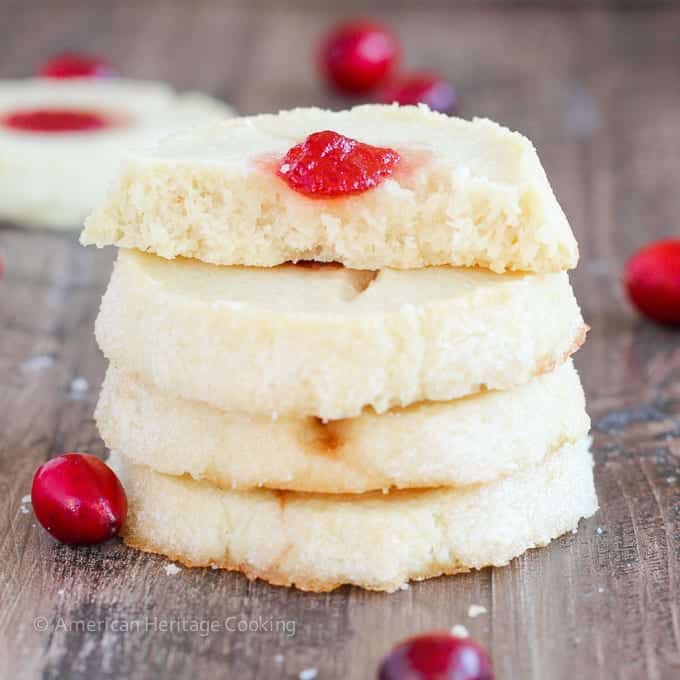 These Cranberry Thumbprint Cookies are a buttery shortbread cookie dough filled with a Moscato cranberry jam and baked to soft, tender perfection. 