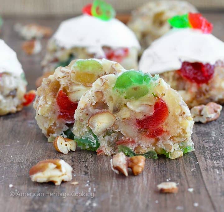 Fruitcake Cookies are chewy sugar cookies stuffed full of candied fruits, raisins and toasted pecans for a unique twist on the classic Christmas fruitcake! Topped with a brandy cream cheese frosting, these little cookies are irresistible!