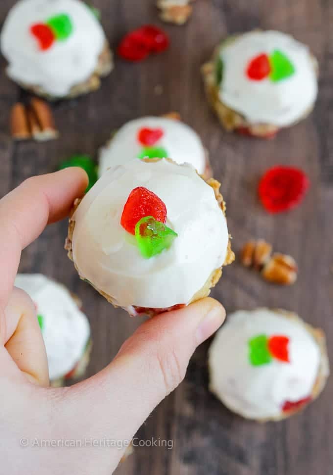 Fruitcake Cookies are chewy sugar cookies stuffed full of candied fruits, raisins and toasted pecans for a unique twist on the classic Christmas fruitcake! Topped with a brandy cream cheese frosting, these little cookies are irresistible! 