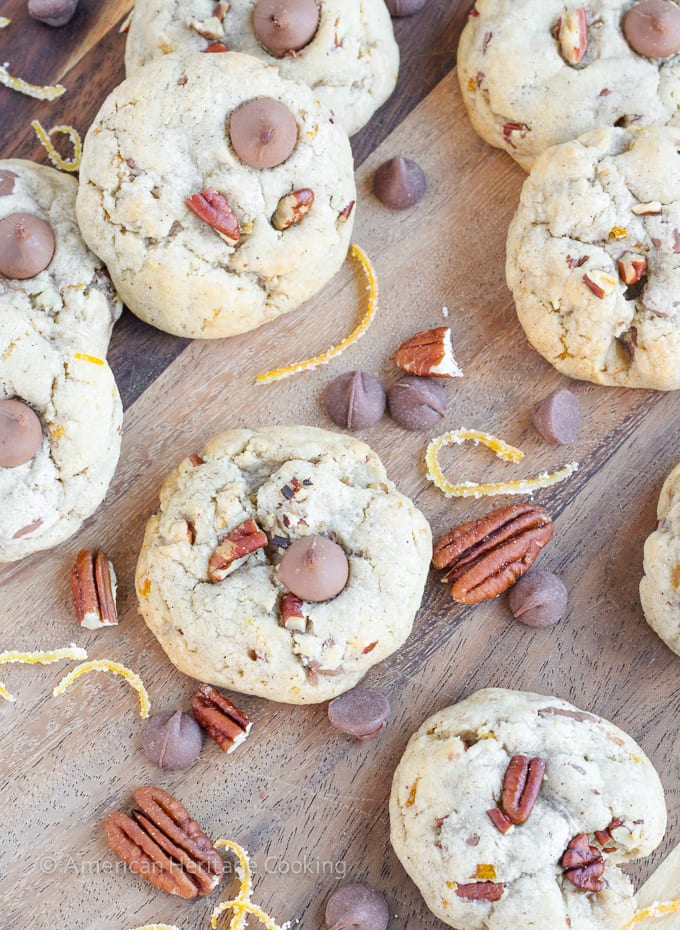 Soft, chewy cinnamon milk chocolate chip cookies with toasted pecans and candied orange peel. These Orange Pecan Milk Chocolate Chip cookies will have you reaching for another before you realize what you’re doing!