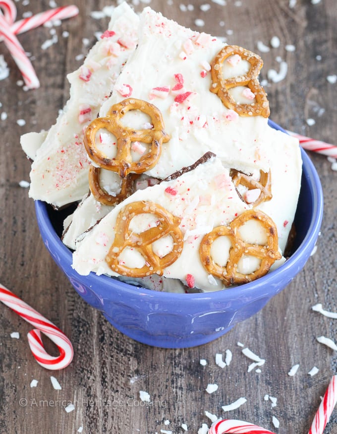 This easy Coconut Peppermint Pretzel Bark is a minty mix of white and dark chocolate with candy cane "snow", salty pretzels and a hint of coconut! You will love the holiday mint flavor! 