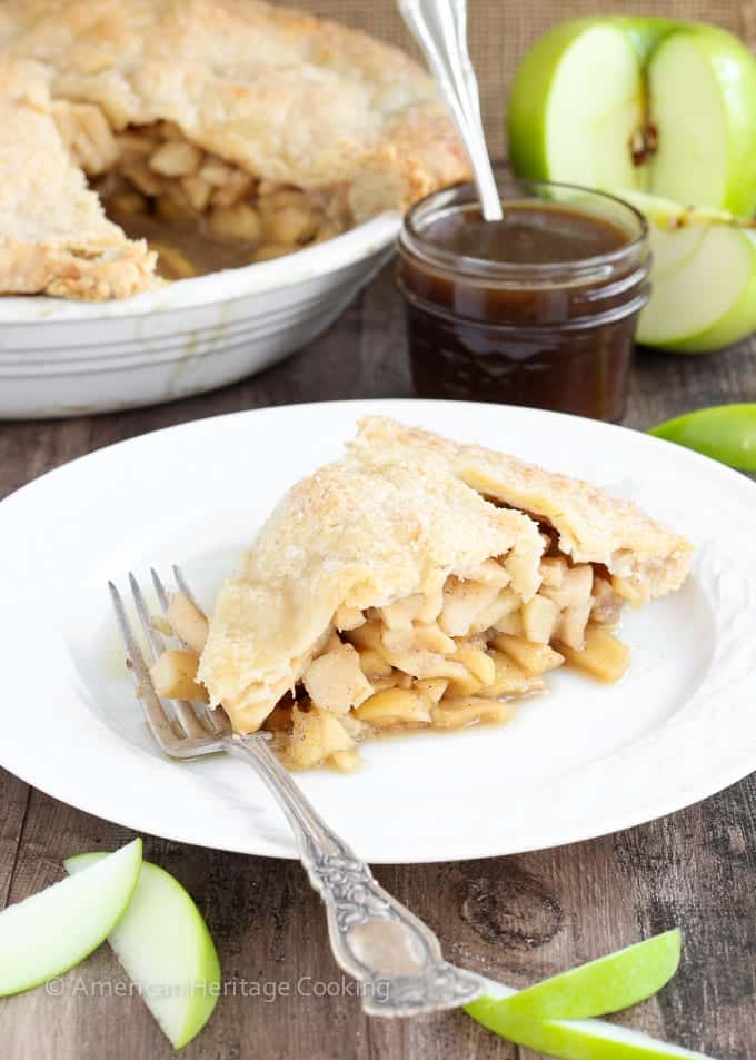 This Apple Butterscotch Pie is absolute heaven! Lightly spiced apples baked inside a flakey all-butter pie crust with a homemade brown sugar butterscotch sauce! 