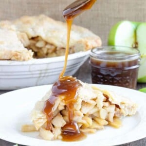 This Butterscotch Apple Pie is absolute heaven! Lightly spiced apples baked inside a flakey all-butter crust with brown sugar butterscotch sauce!