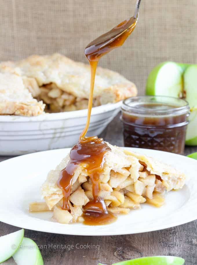 This Apple Butterscotch Pie is absolute heaven! Lightly spiced apples baked inside a flakey all-butter crust with brown sugar butterscotch sauce!