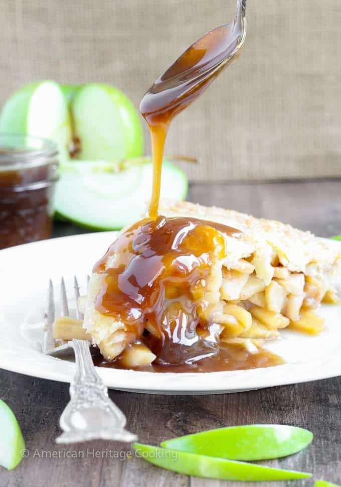 This Apple Butterscotch Pie is absolute heaven! Lightly spiced apples baked inside a flakey all-butter crust with brown sugar butterscotch sauce!