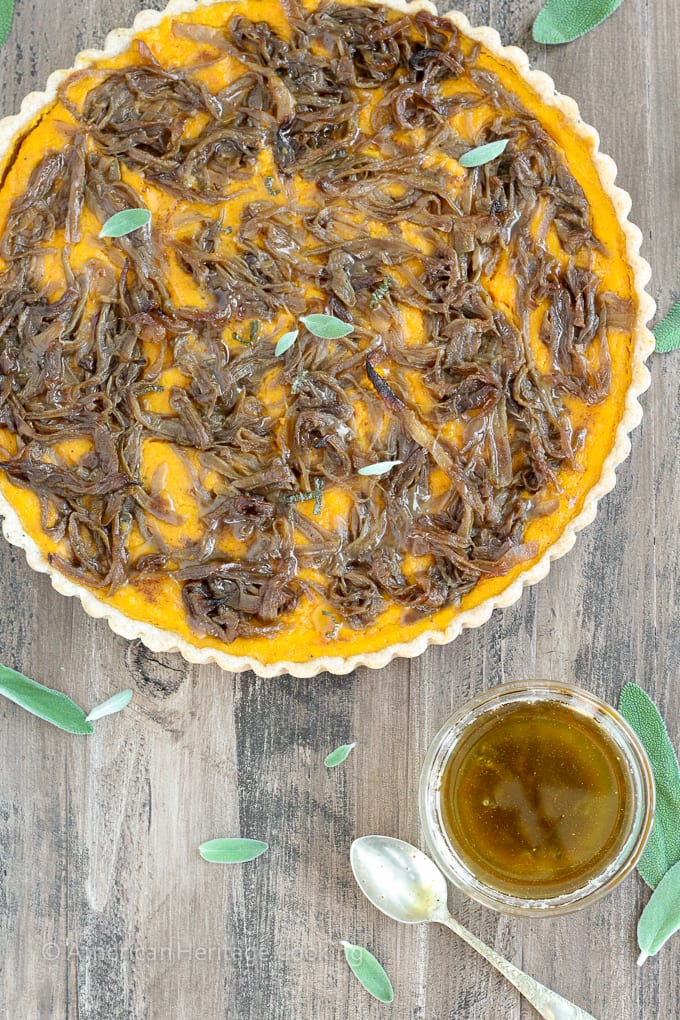 In this savory Butternut Squash Carrot Tart, carrots and butternut squash are roasted with Harissa and Hungarian paprika then covered in caramelized onions, and baked to custardy perfection in a whole-wheat tart shell. All topped with sage browned butter.