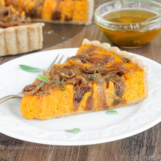 In this savory Butternut Squash Carrot Tart, carrots and butternut squash are roasted with Harissa and Hungarian paprika then covered in caramelized onions, and baked to custardy perfection in a whole-wheat tart shell. All topped with sage browned butter.