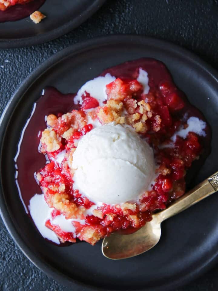 Grandmas Raspberry Rhubarb Crumble black plate gold spoon