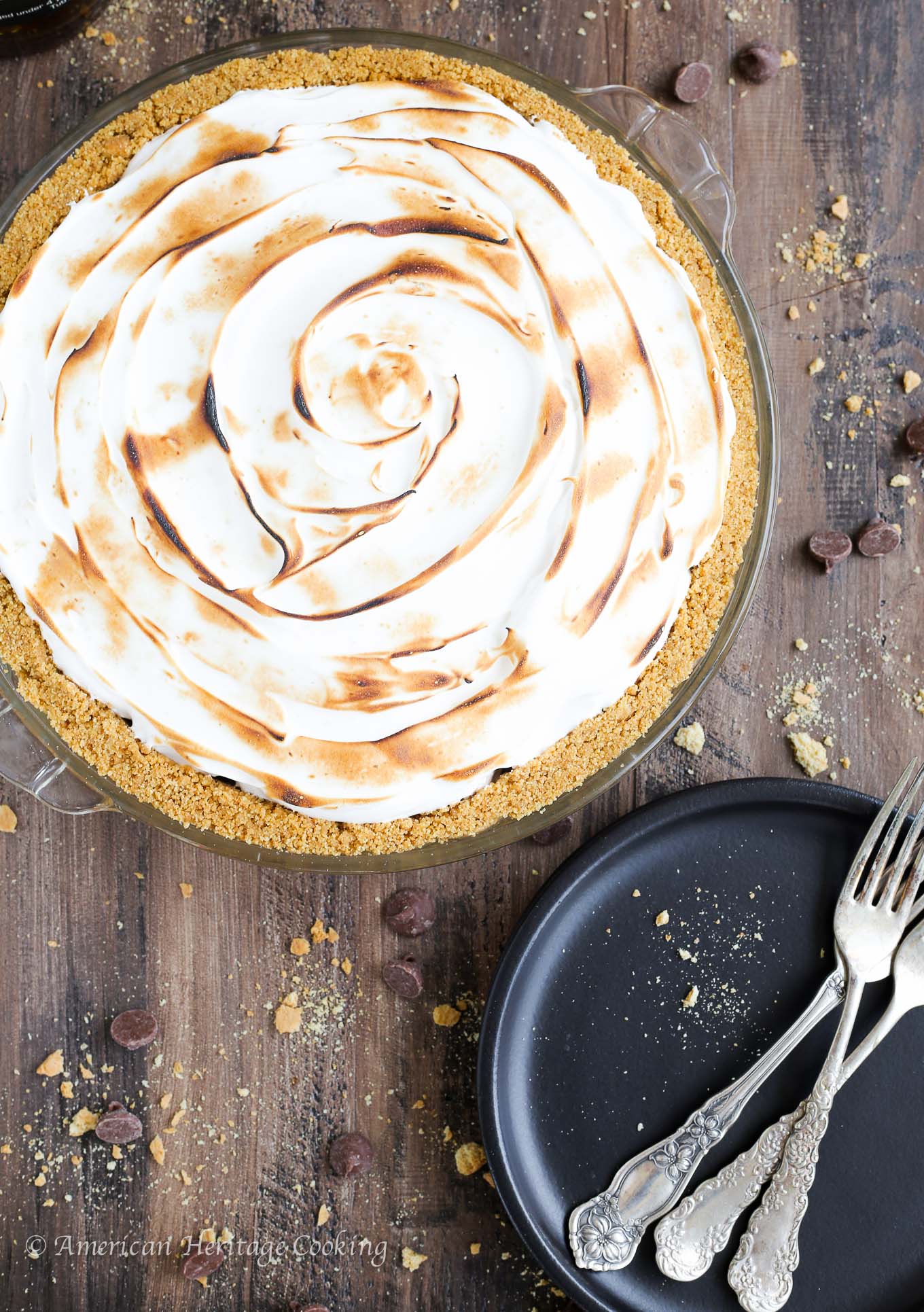 This No Bake Whiskey Smores Pie is a slice of Summer Heaven! There are layers of dark chocolate whisky ganache, milk chocolate mousse and fluffy toasted marshmallow in the perfect graham cracker crust. Go ahead…help yourself to another slice. 