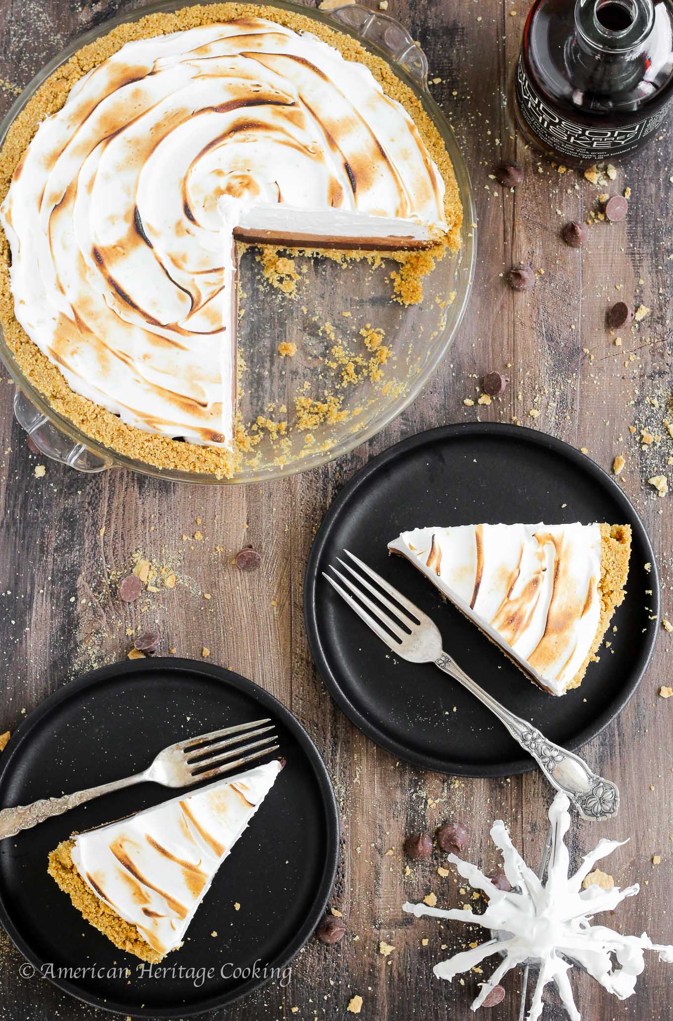 This No Bake Whiskey Smores Pie is a slice of Summer Heaven! There are layers of dark chocolate whisky ganache, milk chocolate mousse and fluffy toasted marshmallow in the perfect graham cracker crust. Go ahead…help yourself to another slice. 