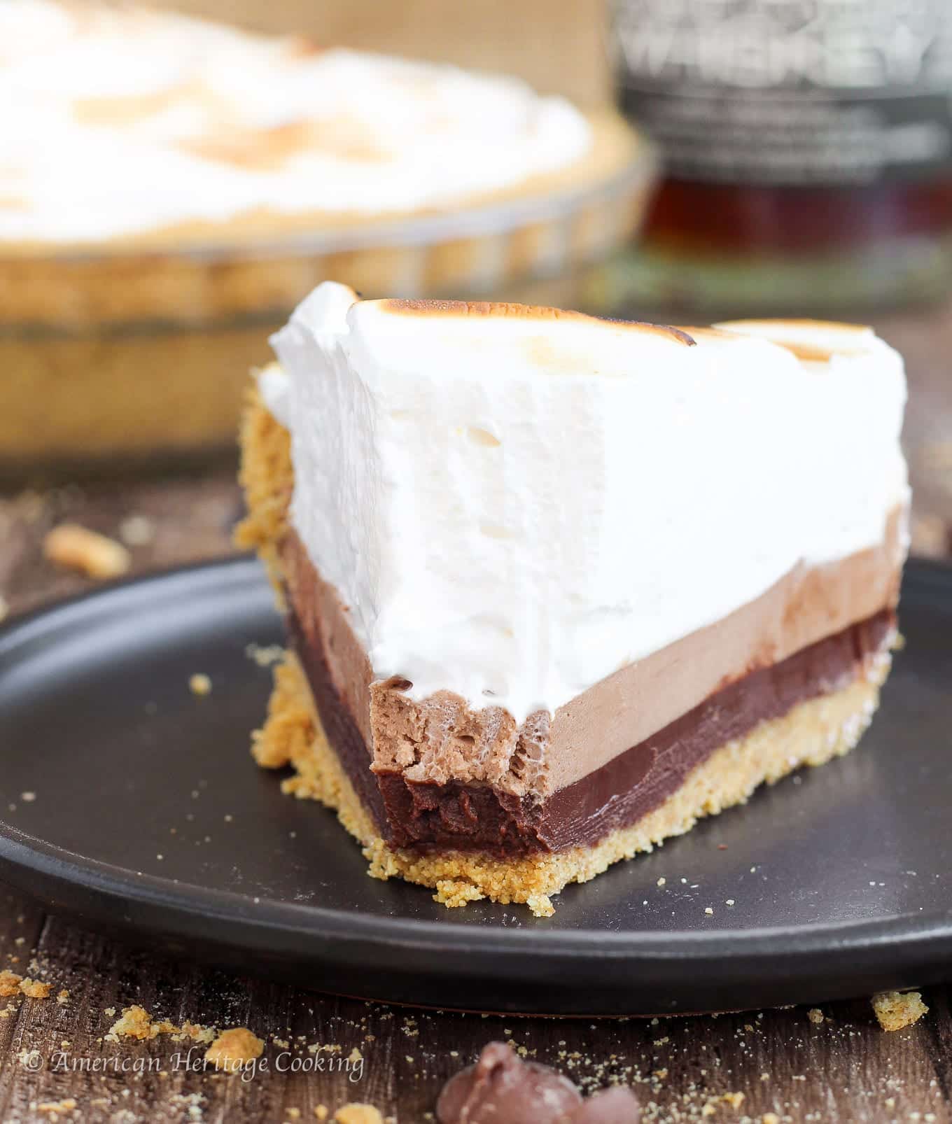 This no bake Whiskey Smores Pie has something for everyone! Graham cracker crust, whiskey ganache, milk chocolate cream cheese mousse and marshmallow fluff! 
