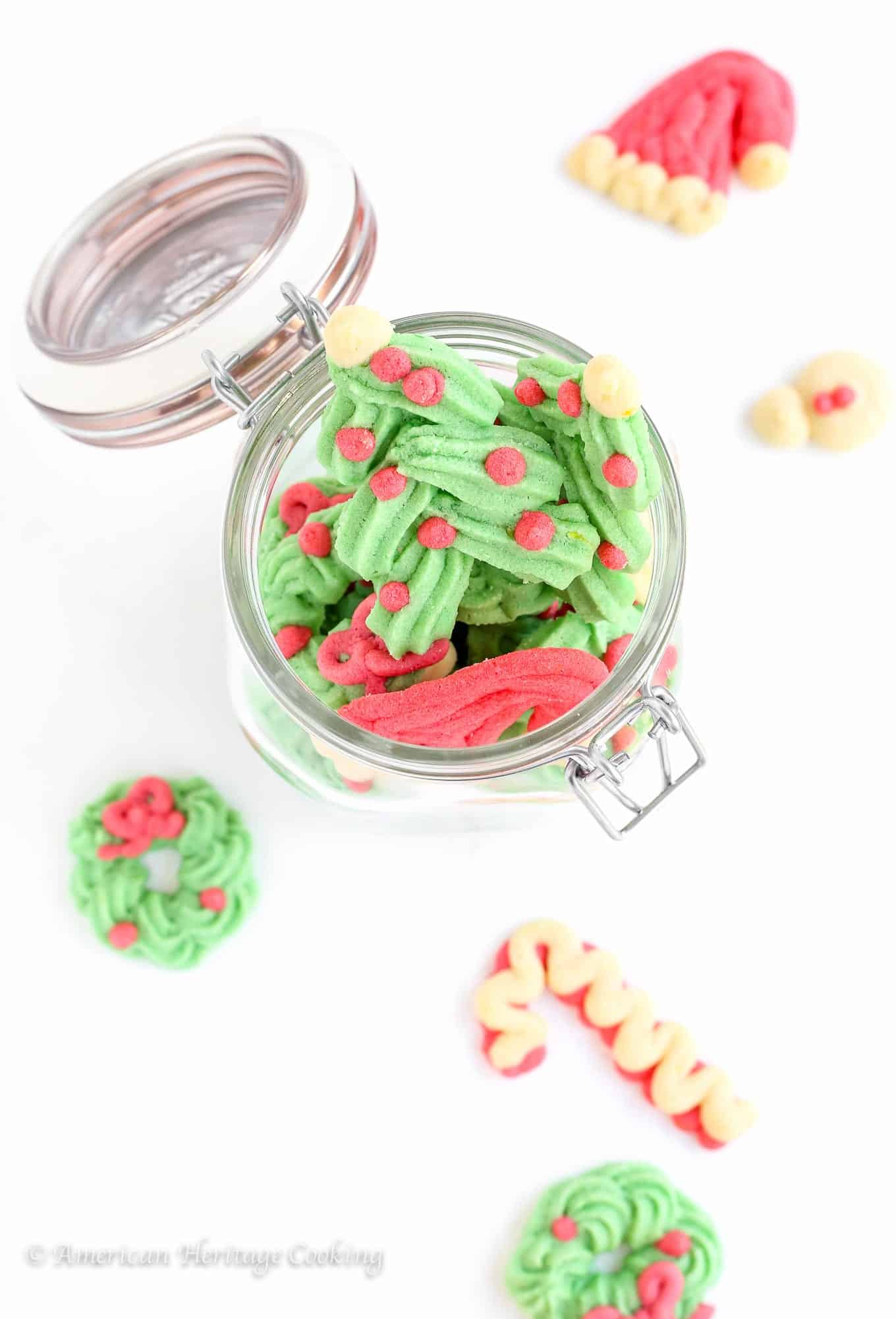 These festive Holiday Spritz Cookies are a light, delicate butter cookie flavored with vanilla and lemon. 
