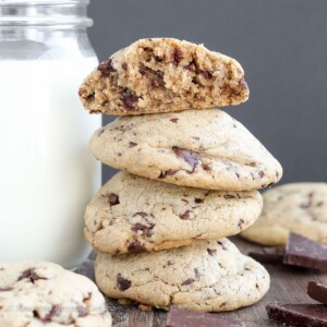 Peanut Butter Chocolate Chip Cookies stacked with milk