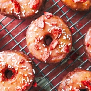 These Lemon Strawberry Cake Donuts have a soft, tender lemon almond cake absolutely coated in a strawberry glaze made with a quick homemade strawberry jam! And easier than you think!