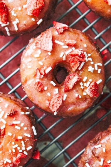 These Lemon Strawberry Cake Donuts have a soft, tender lemon almond cake absolutely coated in a strawberry glaze made with a quick homemade strawberry jam! And easier than you think.
