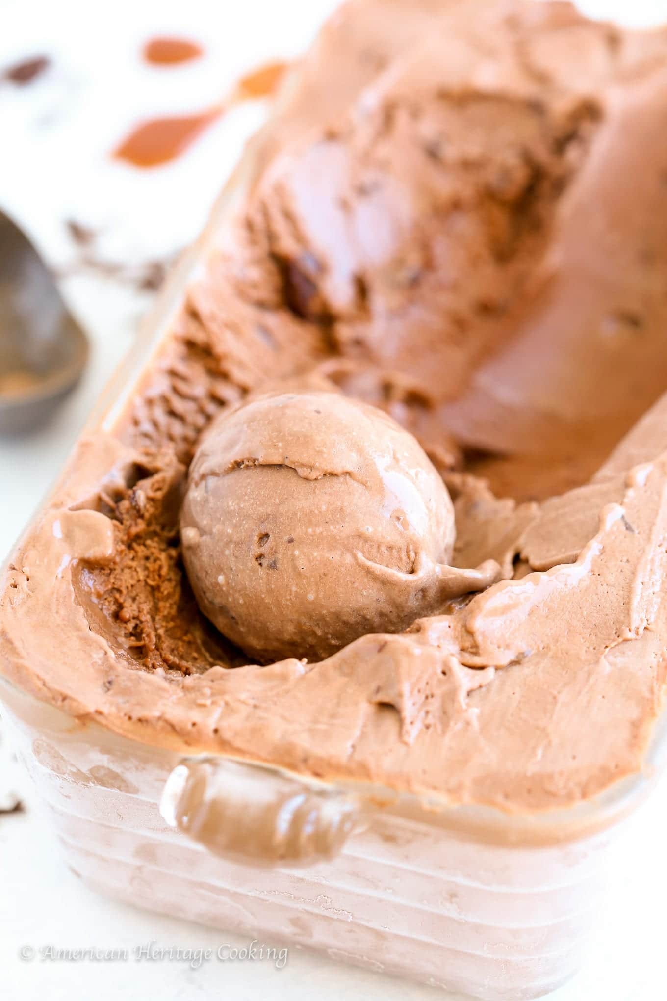 This Double Chocolate Caramel Ice Cream is deeply chocolatey, sinfully rich and 100% decadent. There is caramel sauce in the ice cream and swirled throughout like a silky caramel river with little bits of chopped chocolate taking it to the next level.