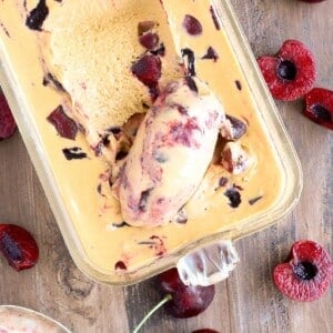 Bourbon Caramel Cherry Ice Cream being scooped with spoon