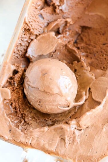 Double Chocolate Caramel Ice Cream in glass container scooped