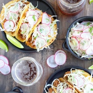 Chorizo Chipotle Tacos mezcal salad on black plates