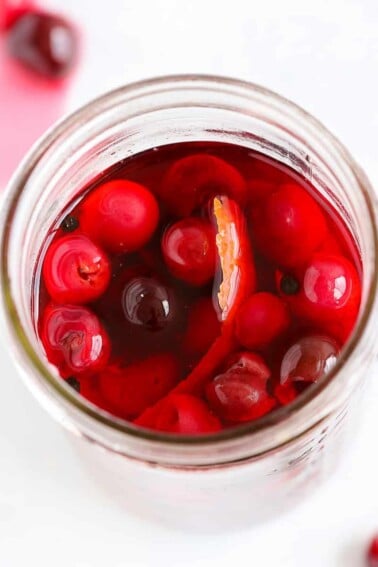 Pickled Cherries in mason jar with liquid