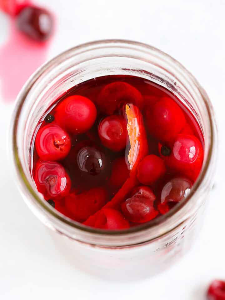 Pickled Cherries in mason jar with liquid