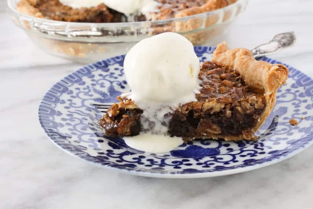 This Bourbon Pecan Pie is creamy, rich and nutty! My vodka all butter pie crust adds the perfect flaky, buttery base for the pecan pie of your dreams!