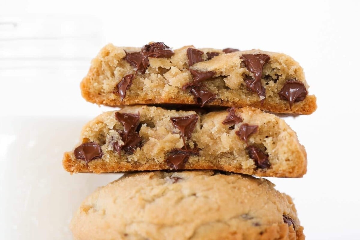 Three chocolate chip cookies stacked.