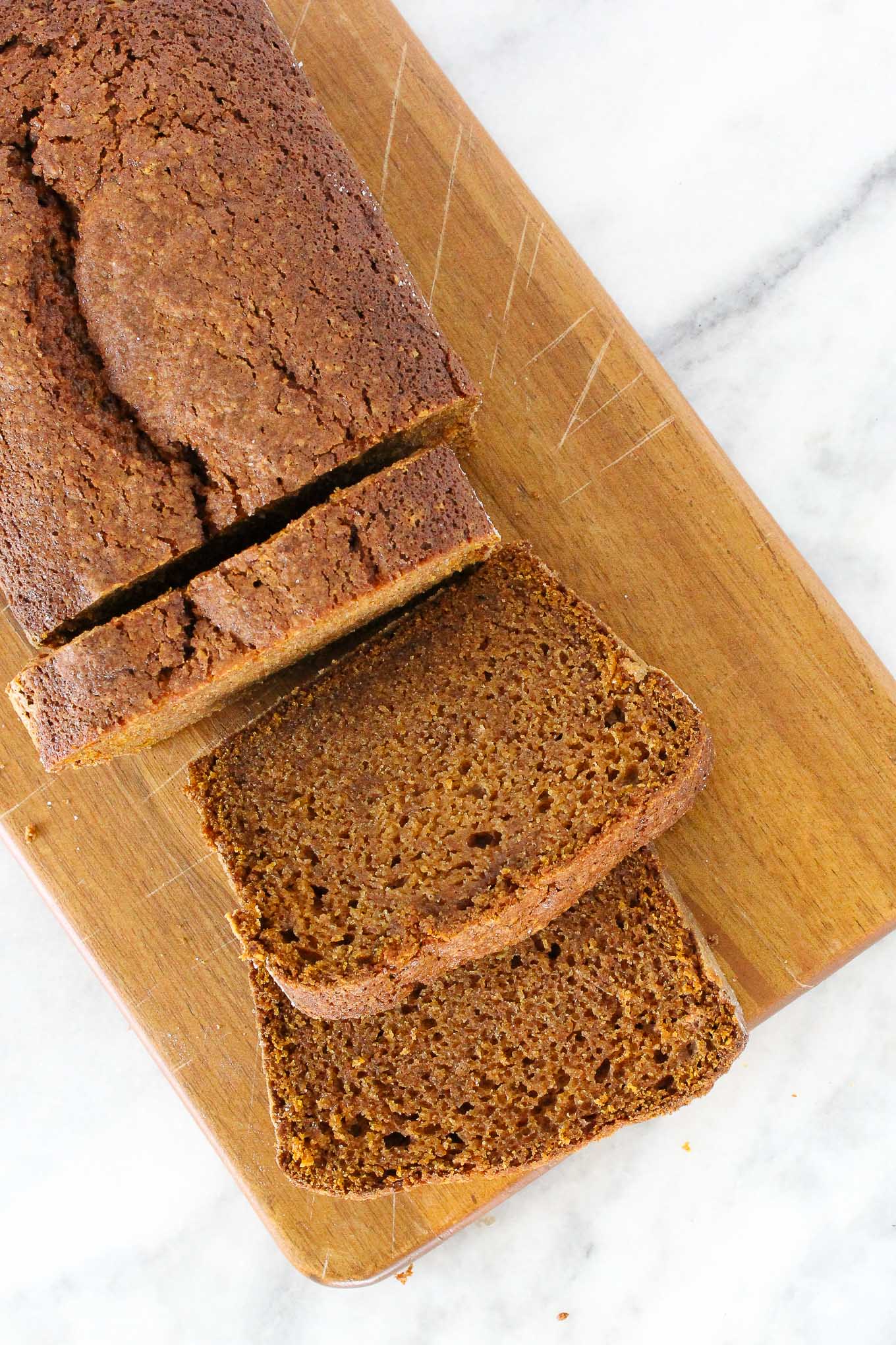 pumpkin bread sliced on wooden board. 