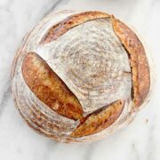 Basic Sourdough Bread tutorial whole loaf on marble