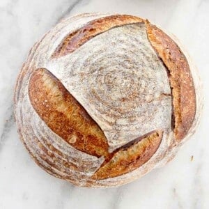 Basic Sourdough Bread tutorial whole loaf on marble