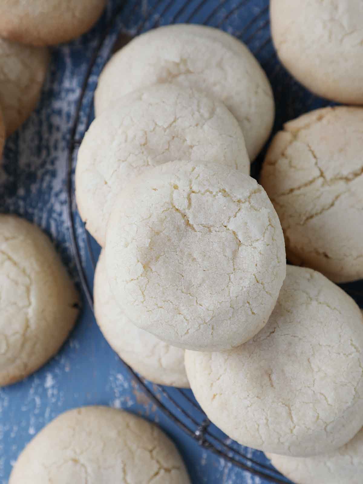 whole sugar cookies cooling on vintage rack.