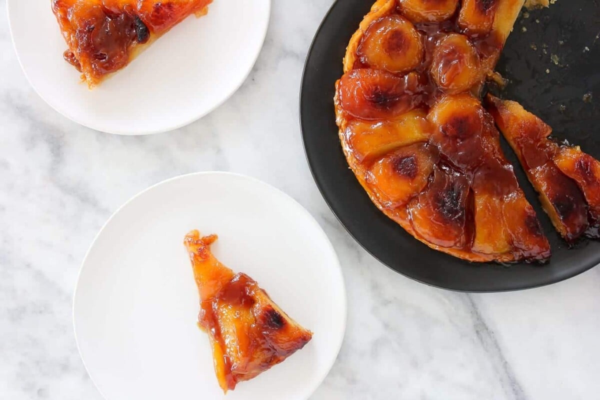 apple tarte tatin on white marble countertop.
