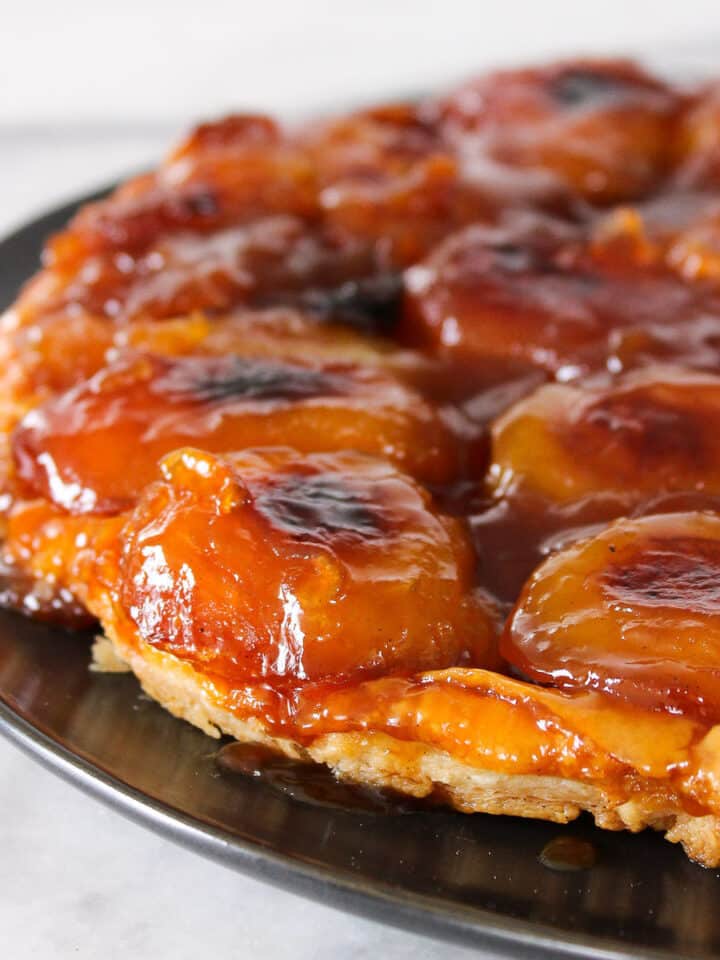Apple Tarte Tatin on black plate
