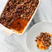 Maple Sweet Potato Casserole in dish and on white plate