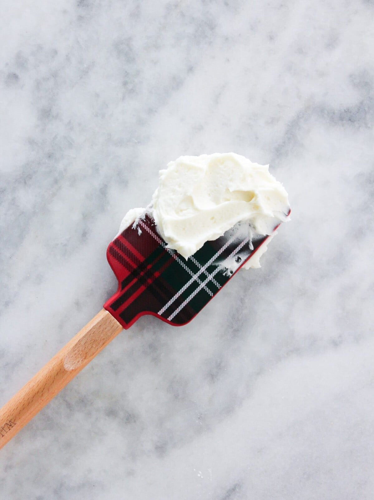 peppermint frosting on plaid spatula.