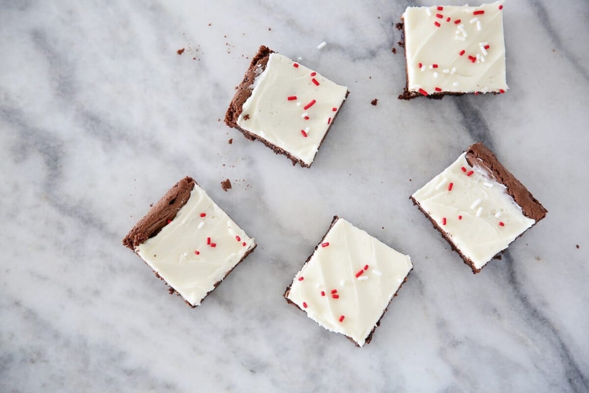 scattered peppermint brownies on countertop.