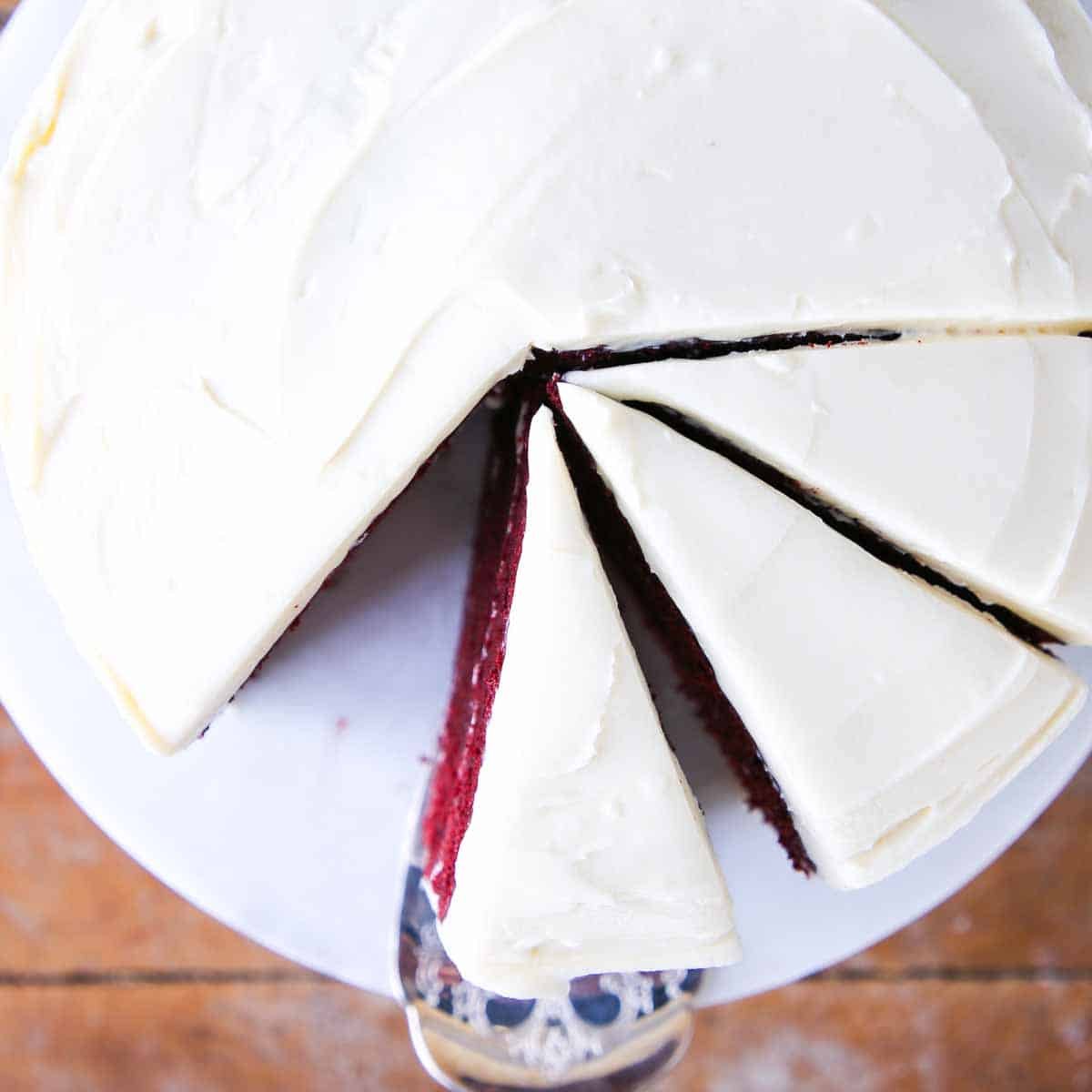 red velvet cake sliced with bourbon cream cheese buttercream.
