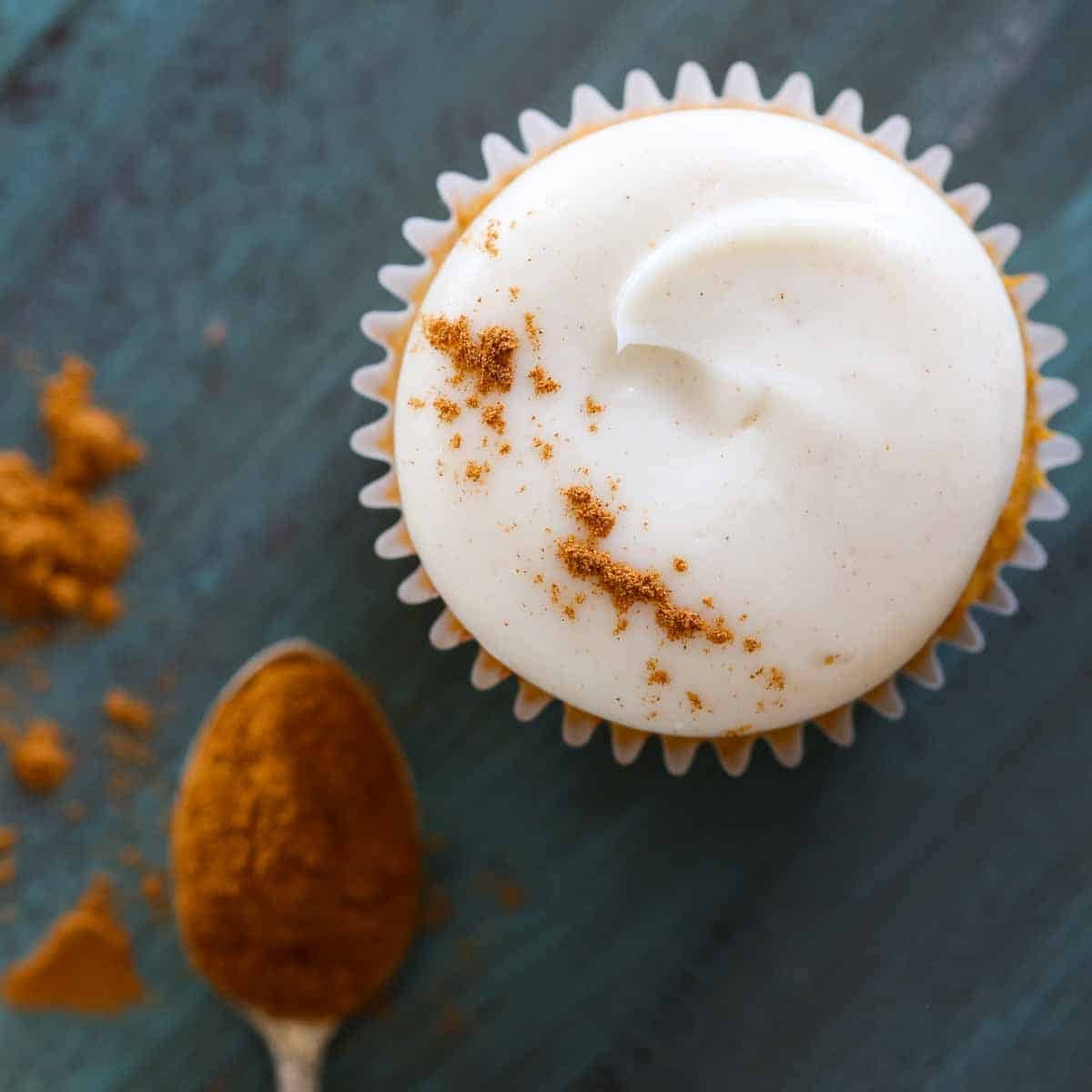 spiced cream cheese buttercream on pumpkin cupcake.