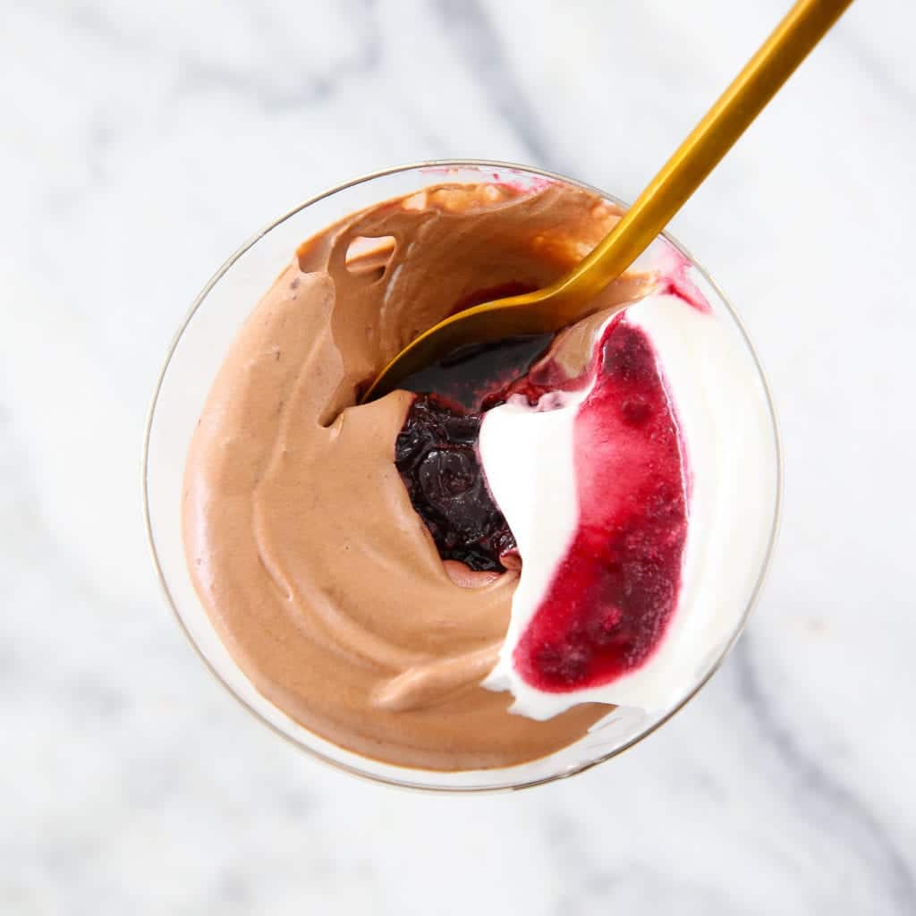 Black Forest Mousse is an easy dark chocolate mousse swirled with a kirsch cherry sauce. 