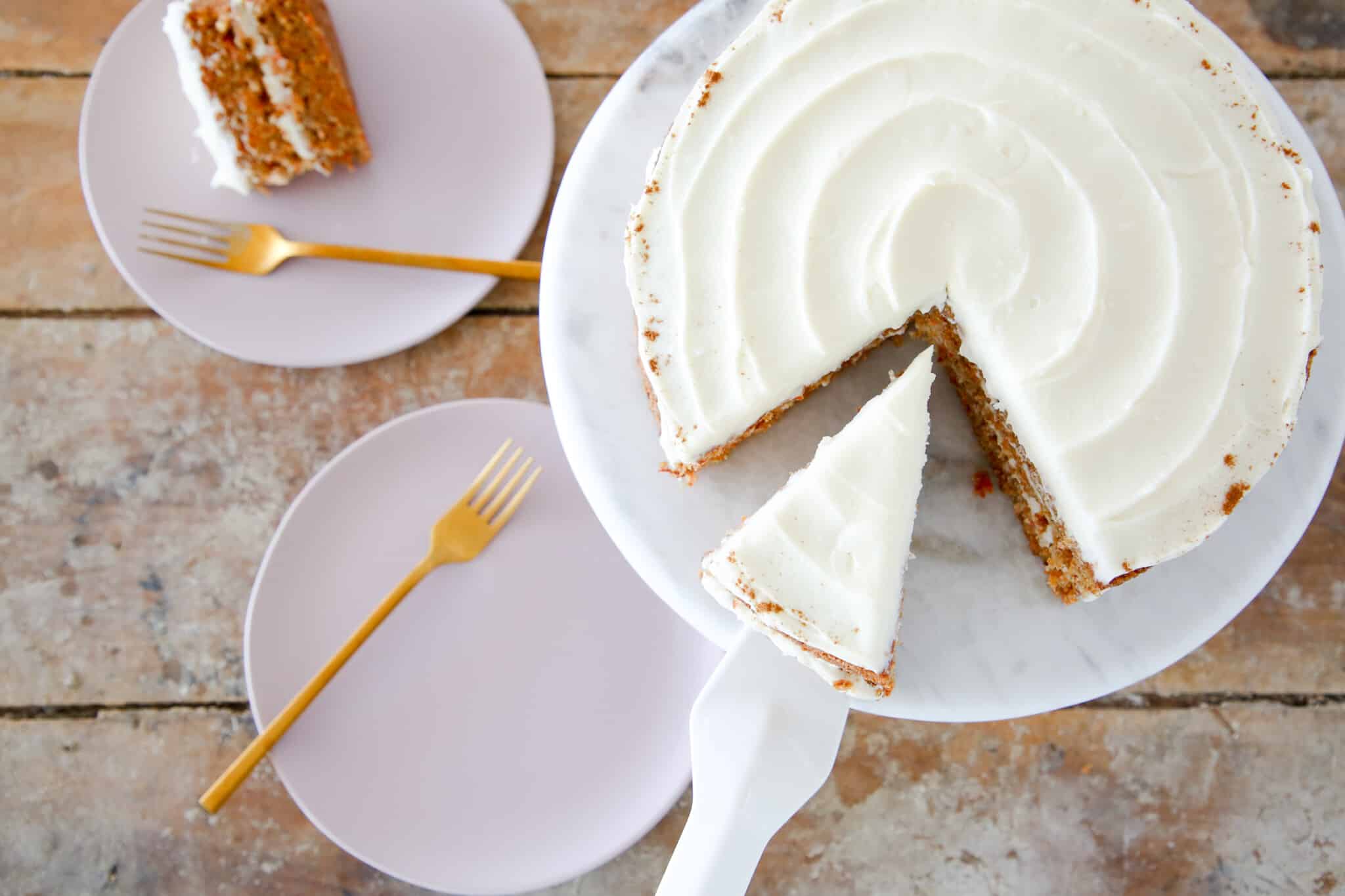 sliced carrot cake with slice of cake being served.