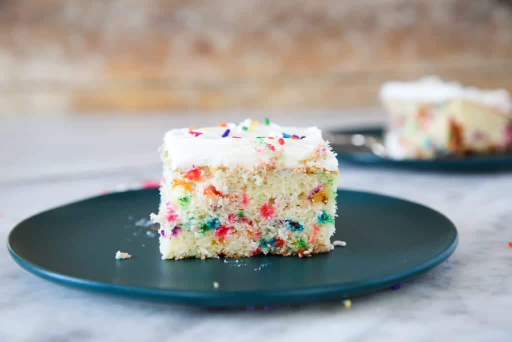 This Funfetti Sheet Cake is decadently moist and packed full of rainbow sprinkles! 